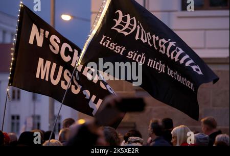 Schwerin, Germany. 10th Oct, 2022. Participants start to a demonstration against the energy policy in the northeast, on banners is written 'N`Scheiss muss ich' and 'Resistance can not be banned'. Credit: Bernd Wüstneck/dpa/Alamy Live News Stock Photo
